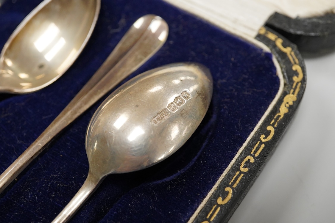 A cased Edwardian silver christening pair by Goldsmiths and Silversmiths Co Ltd, London, 1905, two cased sets of six silver teaspoons, one with a pair of sugar tongs, one other cased silver christening pair, a cased set